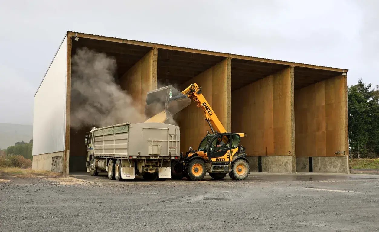 Alpine shed with concrete walls, plywood lining, and drying floors for storing grain and fertiliser in NZ