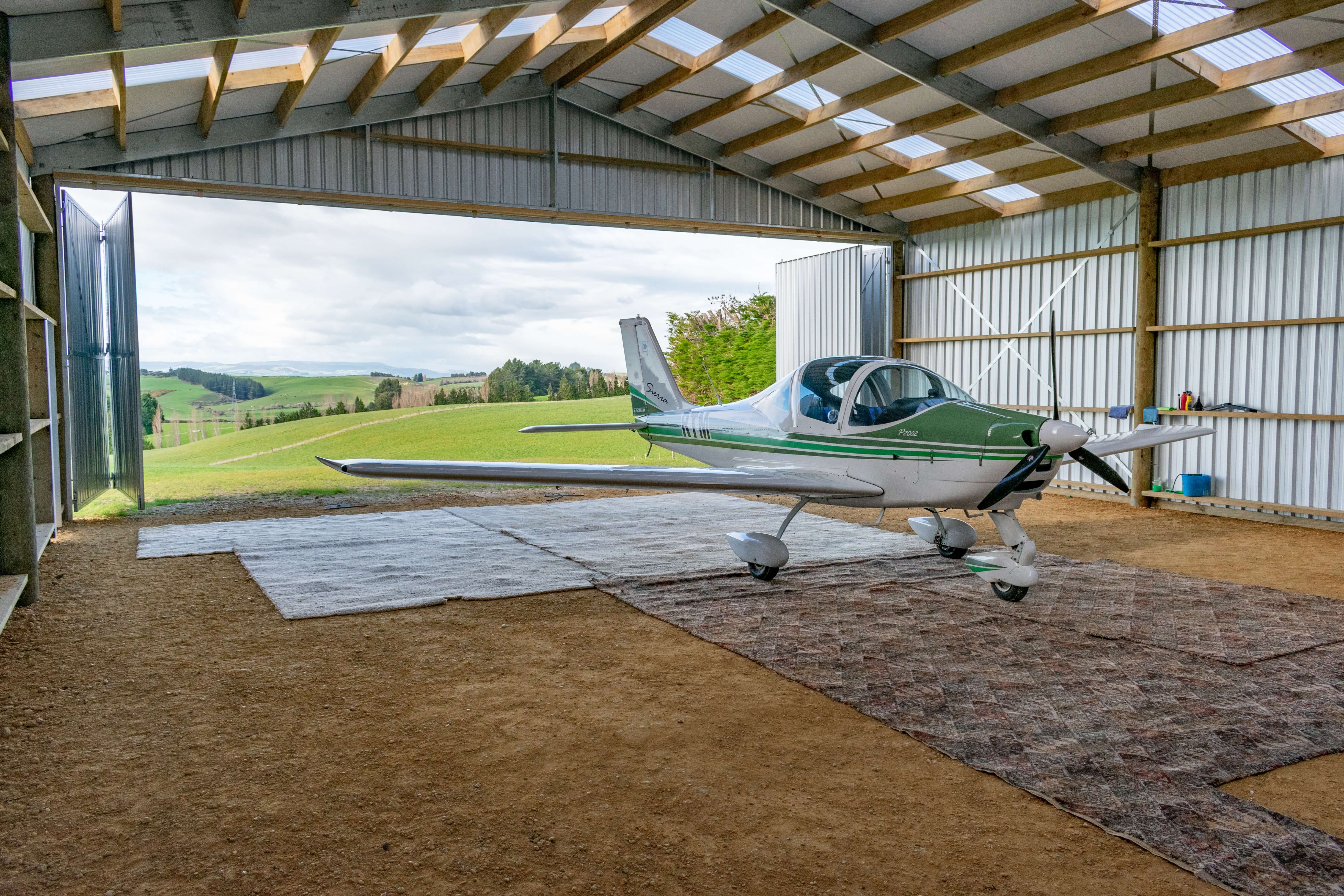 Aircraft hangar with bifolding doors