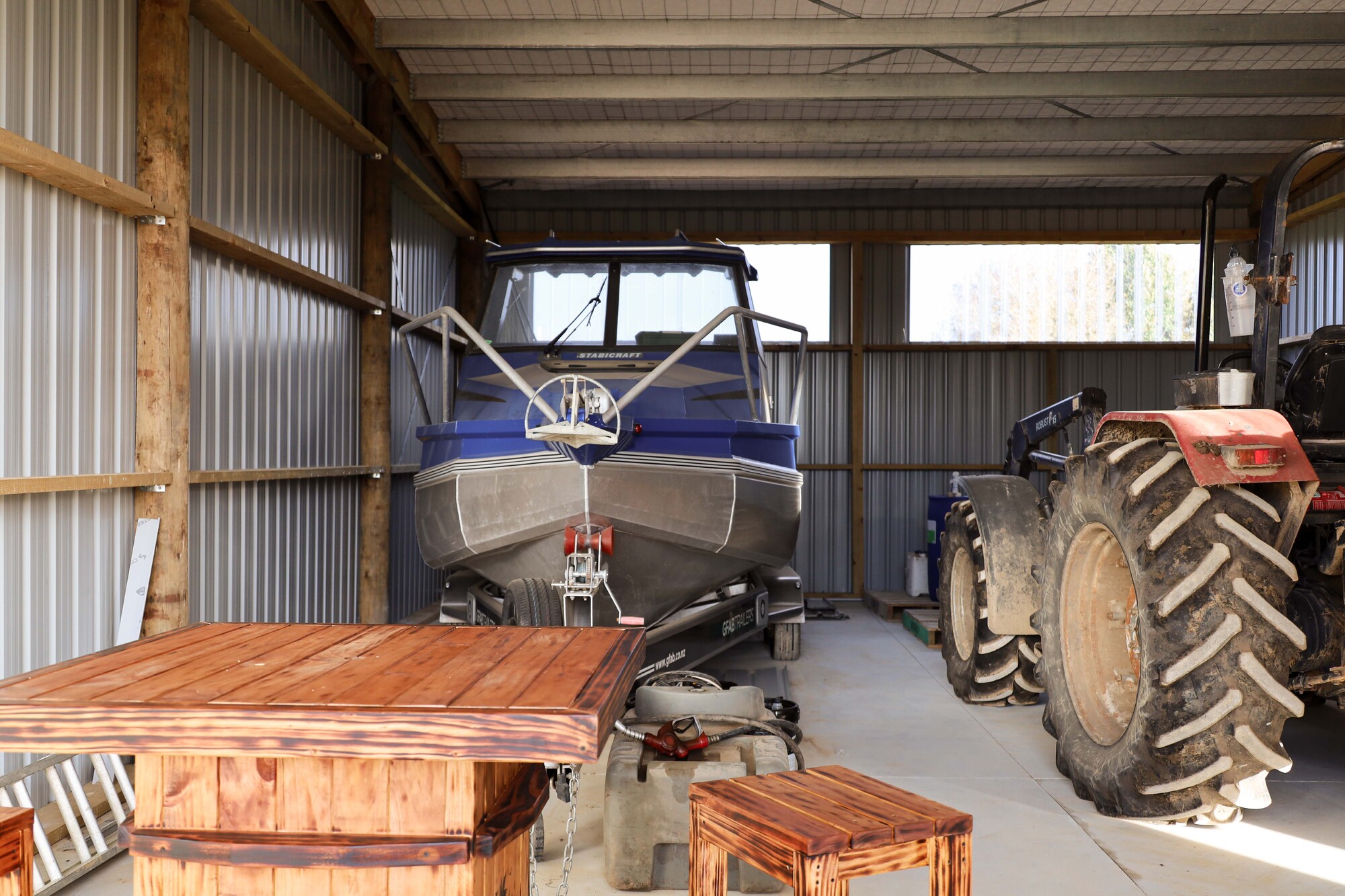 Alpine shed with wide bays for implement storage and man cave