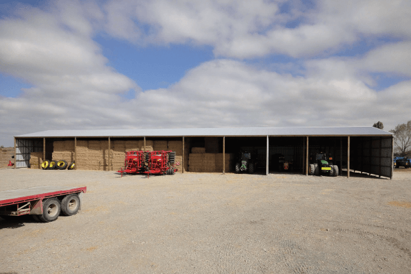 Open-sided bulk storage shed