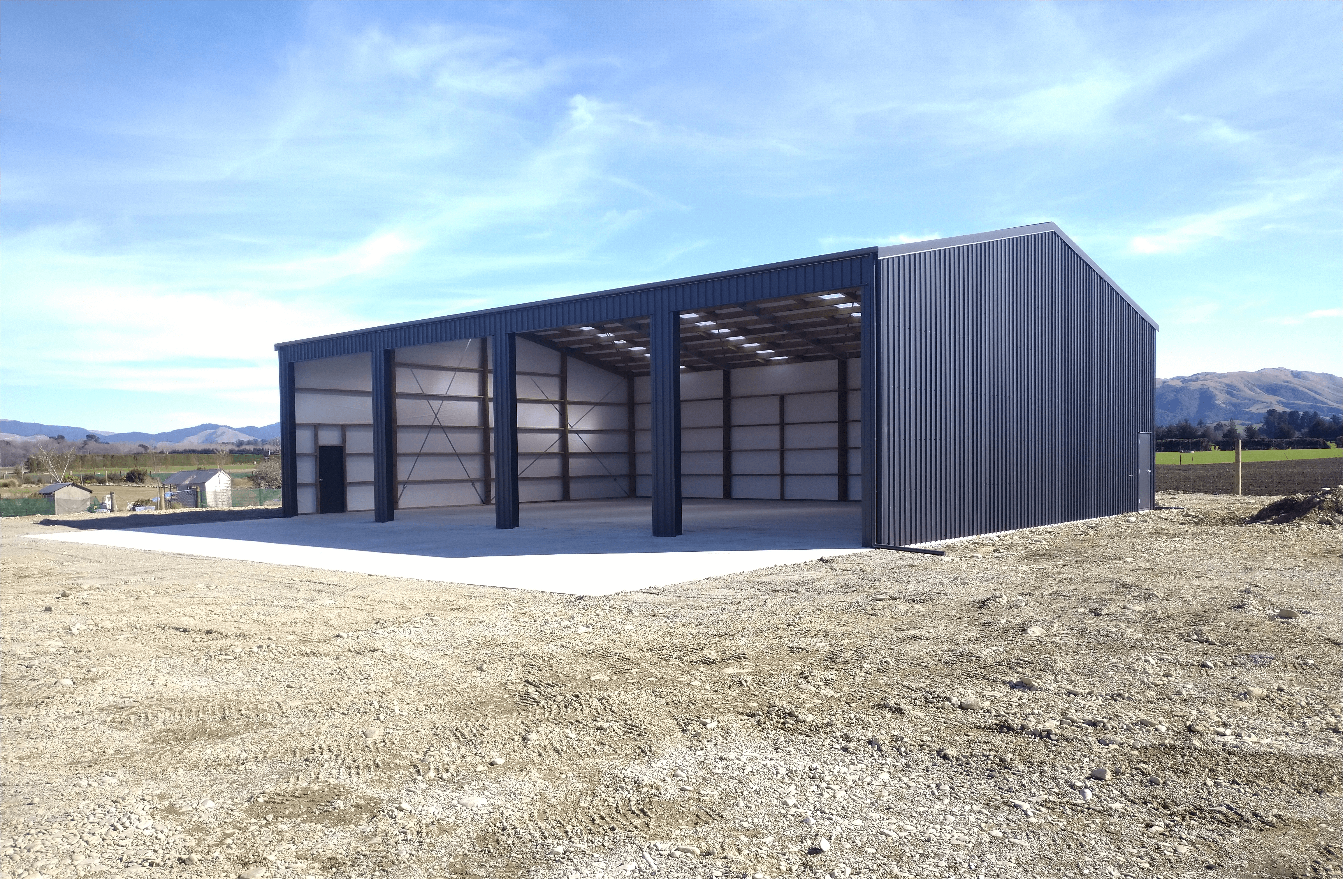 This clearspan gable workshop features birdproof rafters to keep the farming equipment clean and tidy.